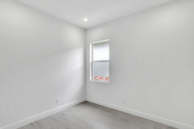 10125 Driftwood Way, Palm Beach Gardens, FL 33412 - empty room featuring baseboards and recessed lighting