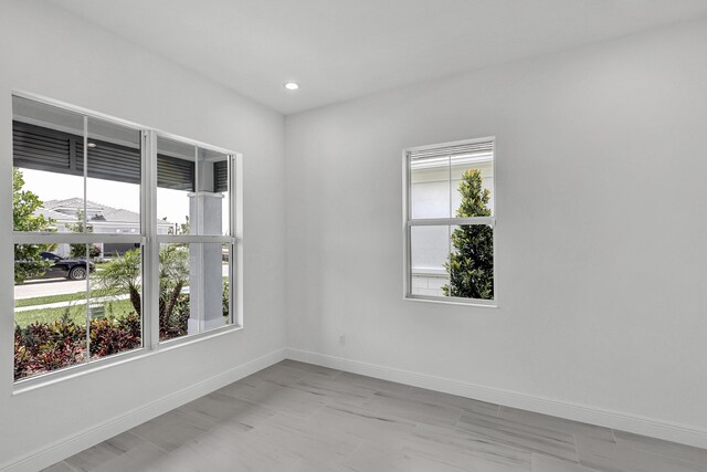 10125 Driftwood Way, Palm Beach Gardens, FL 33412 - empty room with plenty of natural light and recessed lighting
