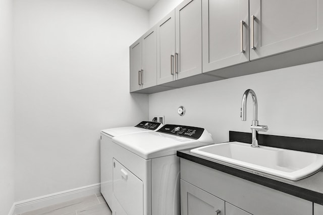 10125 Driftwood Way, Palm Beach Gardens, FL 33412 - laundry area featuring washer and clothes dryer and cabinet space