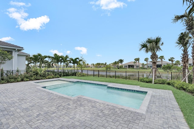 10125 Driftwood Way, Palm Beach Gardens, FL 33412 - view of swimming pool featuring a water view, a patio area, and a fenced backyard