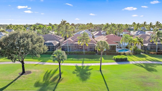 view of home's community with a yard and a pool