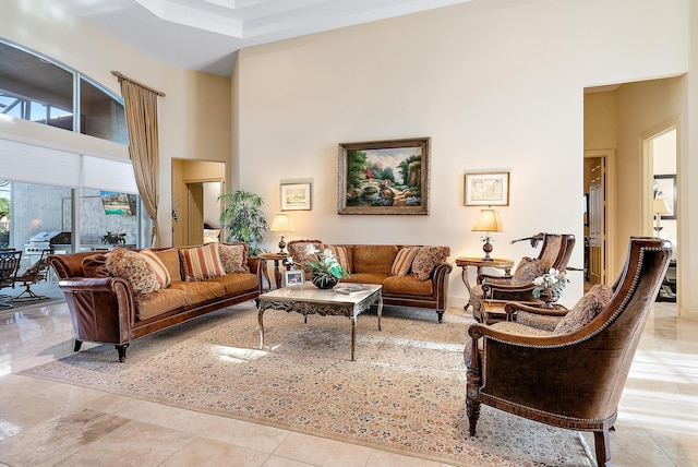 living room with a towering ceiling