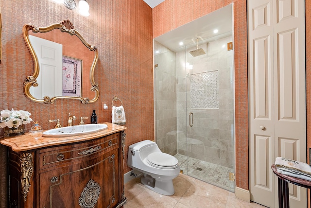 bathroom with walk in shower, vanity, tile patterned flooring, and toilet