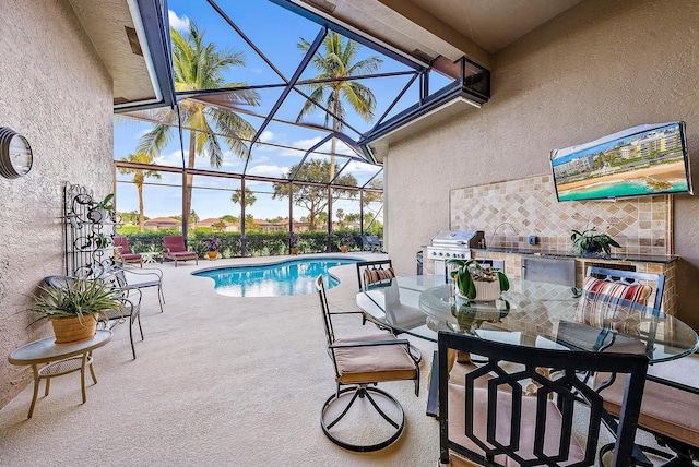 view of pool featuring grilling area, glass enclosure, and a patio area