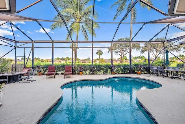 view of pool with a lanai and a patio