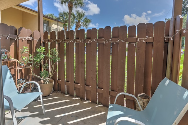 view of patio featuring a gate
