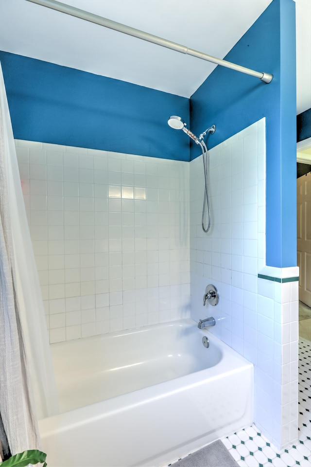 bathroom featuring shower / tub combo and tile patterned flooring