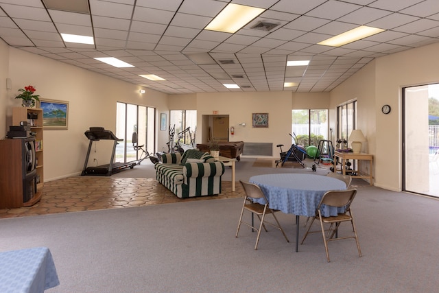 carpeted dining space featuring visible vents