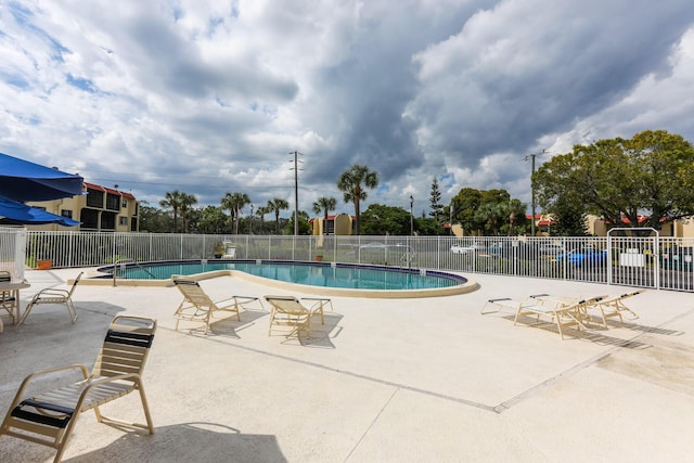 pool featuring a patio and fence