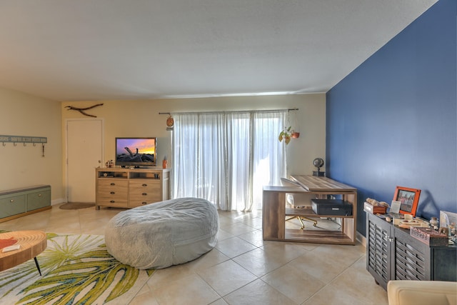 living area with tile patterned floors