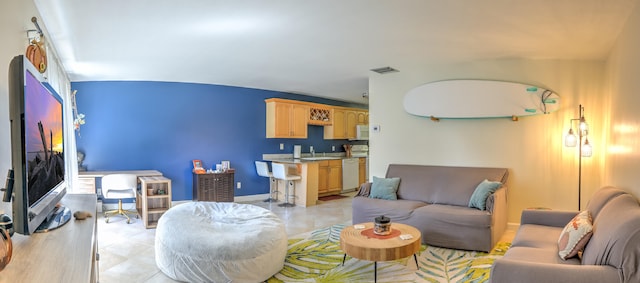 living room with visible vents and baseboards