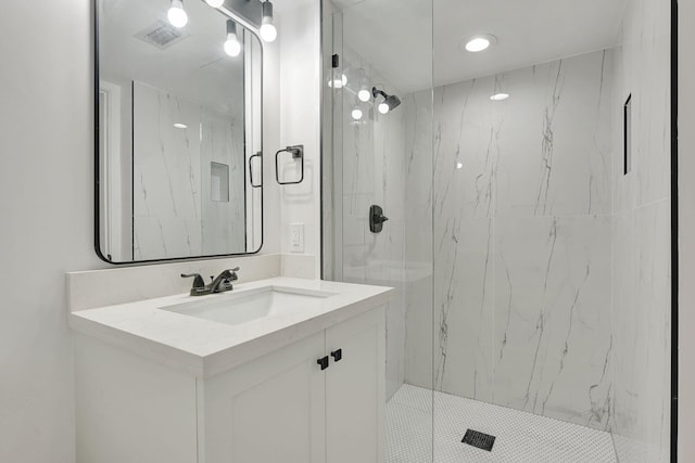 bathroom featuring vanity and an enclosed shower