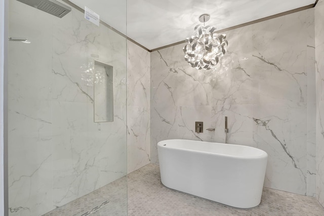 bathroom with an inviting chandelier, separate shower and tub, and tile walls