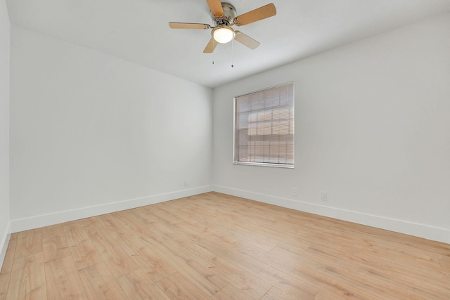 empty room featuring light wood-type flooring and ceiling fan