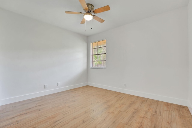 empty room with light hardwood / wood-style flooring and ceiling fan