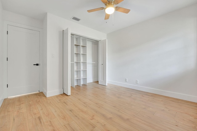 unfurnished bedroom with ceiling fan and light hardwood / wood-style flooring