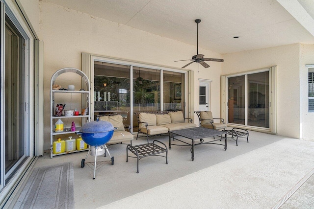 view of patio / terrace featuring ceiling fan and an outdoor living space