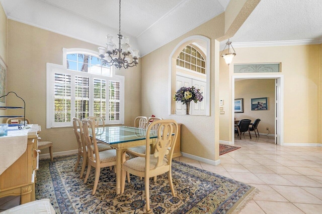 tiled dining space featuring lofted ceiling, a chandelier, a textured ceiling, and crown molding