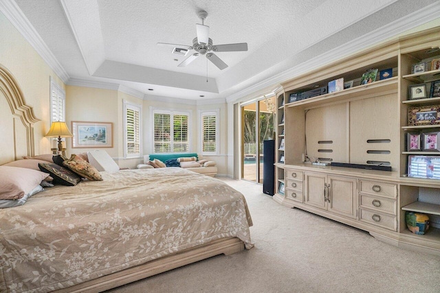 bedroom with access to outside, ceiling fan, a raised ceiling, a textured ceiling, and light colored carpet