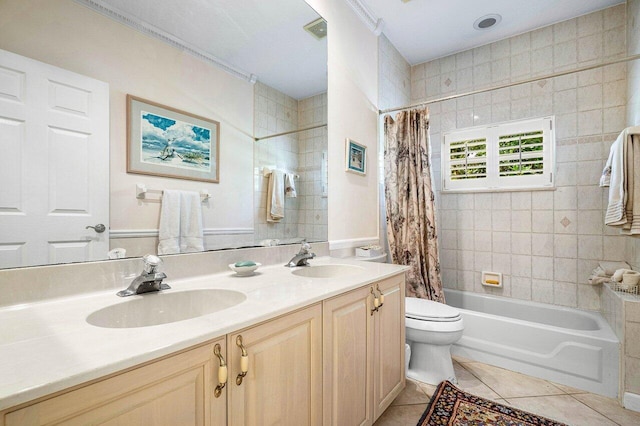 full bathroom featuring shower / bath combo, vanity, toilet, and tile patterned floors