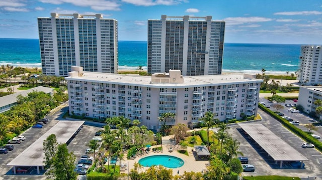 bird's eye view featuring a view of the beach and a water view