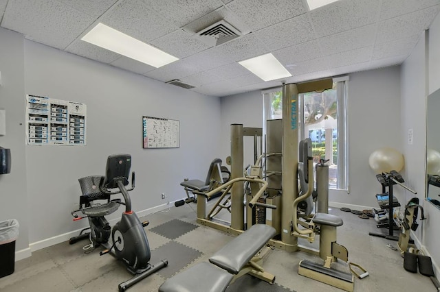 workout area with a drop ceiling