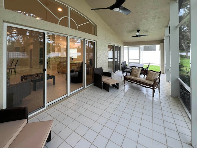 sunroom with vaulted ceiling and ceiling fan