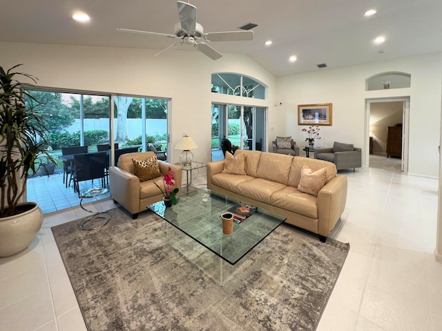 tiled living room featuring high vaulted ceiling and ceiling fan