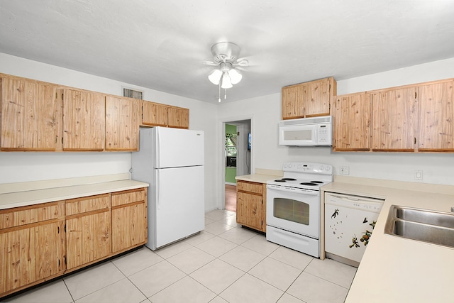 kitchen featuring light tile patterned floors, white appliances, ceiling fan, and sink