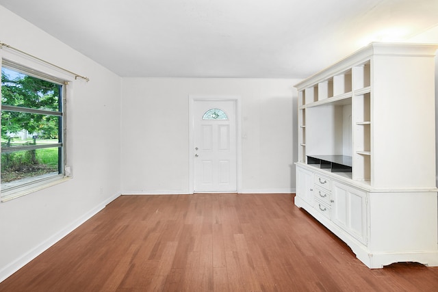 unfurnished living room featuring hardwood / wood-style floors