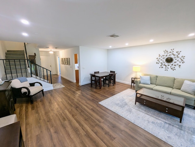 living room featuring dark wood-type flooring