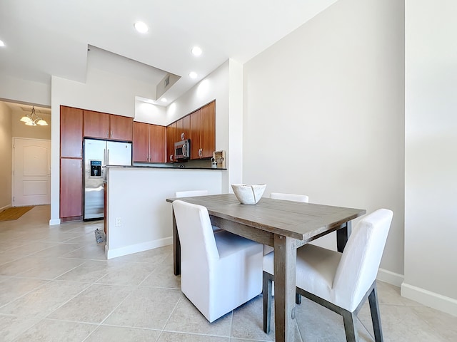 dining area with recessed lighting, baseboards, and light tile patterned floors