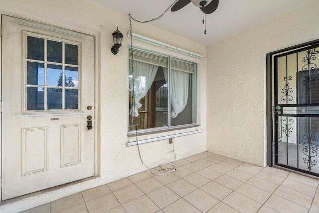333 Knotty Pine Cir Unit C-2, Greenacres, FL 33463 - entrance to property featuring stucco siding and a ceiling fan