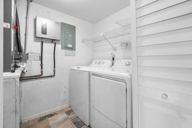 clothes washing area featuring washer and clothes dryer and electric panel