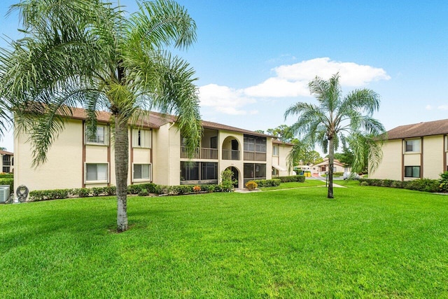 exterior space with a balcony and central AC unit