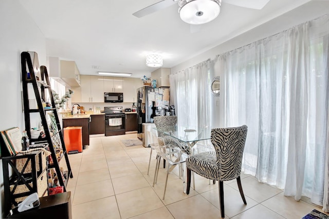 tiled living room featuring ceiling fan