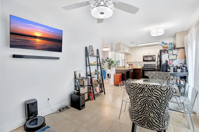 dining area with light tile patterned flooring and ceiling fan