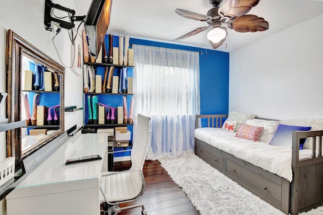 bedroom featuring ceiling fan and dark hardwood / wood-style flooring