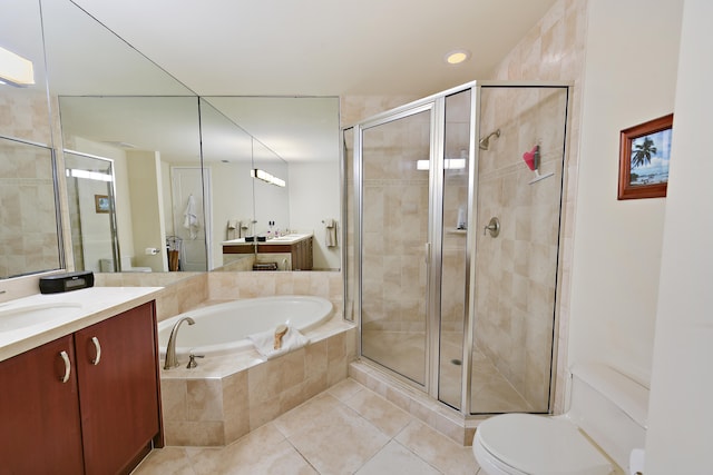 full bathroom with shower with separate bathtub, tile patterned flooring, vanity, and toilet