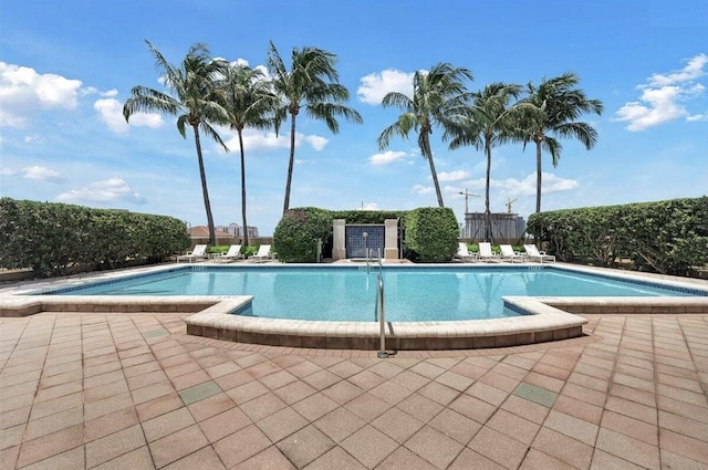 view of swimming pool featuring a patio area