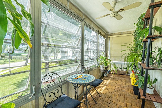 sunroom / solarium with ceiling fan and plenty of natural light