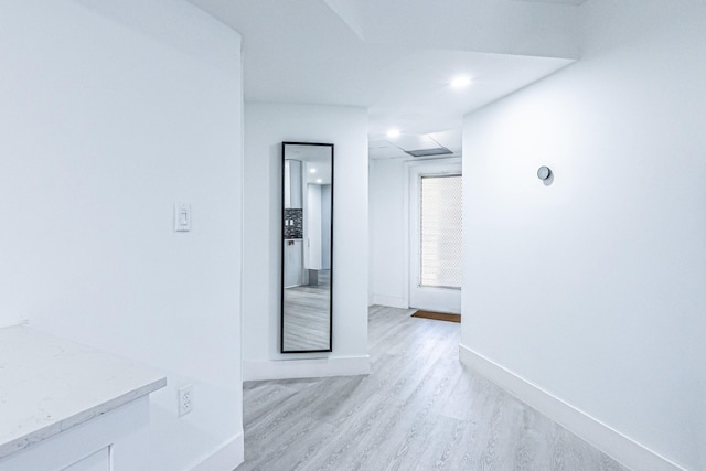 corridor featuring light hardwood / wood-style floors