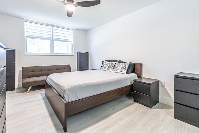 bedroom featuring light wood-type flooring and ceiling fan