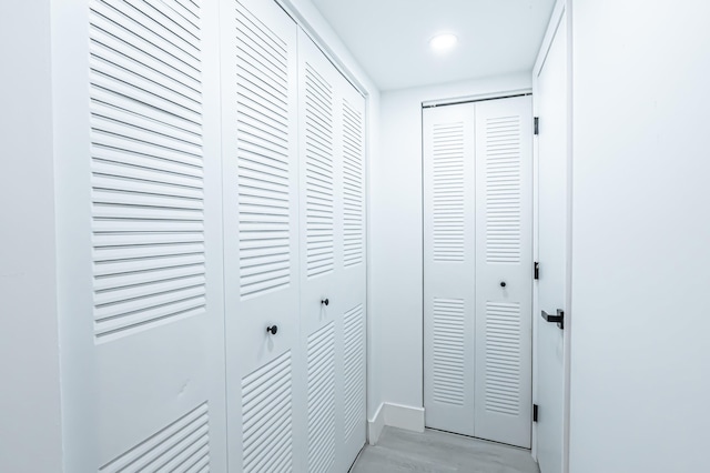 hallway with light hardwood / wood-style flooring