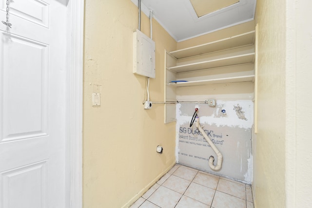 laundry room featuring light tile patterned flooring