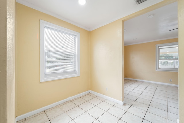 unfurnished room with light tile patterned floors and ornamental molding