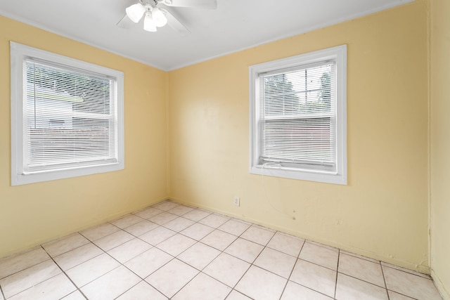 tiled empty room with ceiling fan