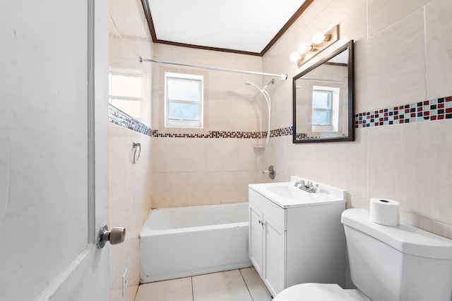 full bathroom featuring vanity, tile walls, tiled shower / bath combo, and toilet