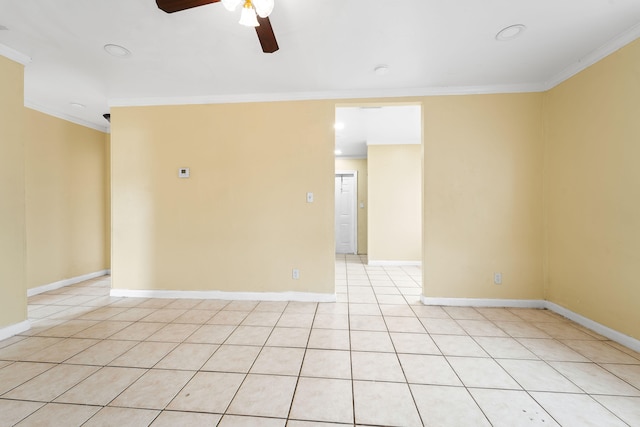 tiled empty room with ornamental molding and ceiling fan