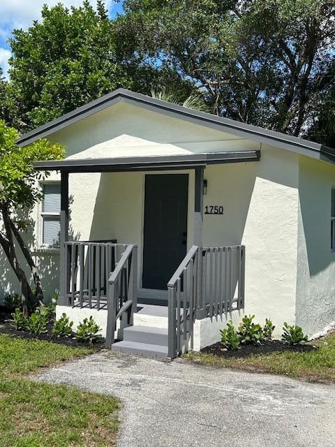 entrance to property with a porch